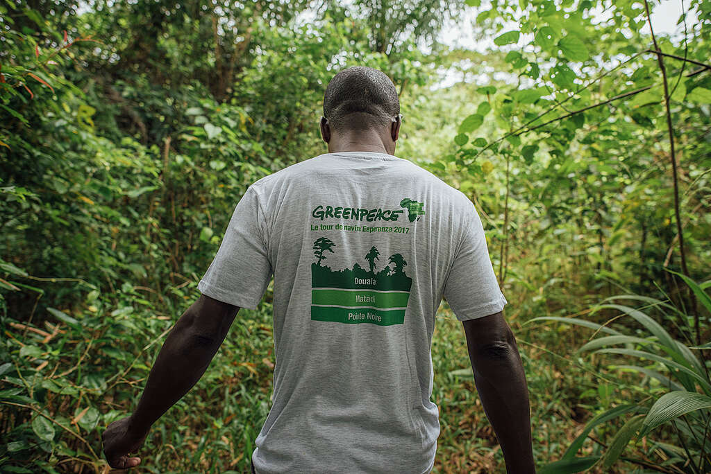 Raoul Monsembul (Greenpeace Country Coordinator DRC, Forest Campaign) wearing the Greenpeace Campaign T-shirt. A team from Greenpeace Africa are working with local partners to conduct scientific research in the village of Lokolama, 45 km from Mbandaka. The team aim to identify the presence of tropical peatlands in the region, and to measure its depth.