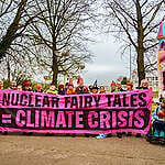 Activists use fairy costumes and an inflatable castle to protest outside the Nuclear Energy Summit in Brussels, Belgium, near the Atomium building. The summit is co-hosted by the Belgian Prime Minister Alexander de Croo and the International Atomic Energy Agency, and features several heads of state including French President Emmanuel Macron as well as some 300 nuclear industry delegations. The gathering aims to accelerate the goal of tripling global nuclear energy capacity by 2050, a goal the protestors denounce as pure fantasy. The activists come from some of the more than 500 organisations who this week signed a joint declaration opposing nuclear energy and demanding that governments focus on building renewables like wind and solar power instead. Read the full statement and list of signatories at dont-nuke-the-climate.org