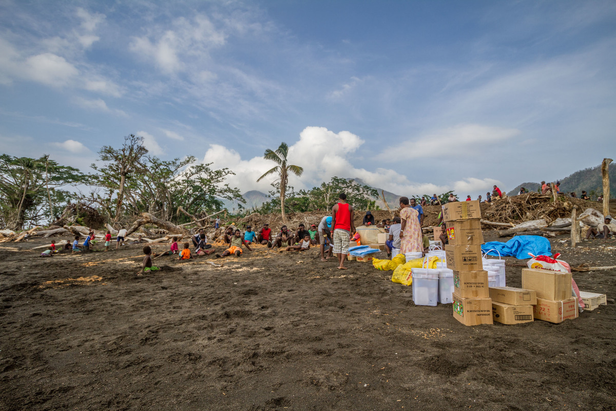 Food supplies from Greenpeace lining the seashore of Port Narvin Village, Erromango. Extreme weather events, such as Cyclone Pam, threaten to become the new normal for Pacific island states as the global climate changes, underscoring the urgency to cut global emissions to avert a climate crisis.