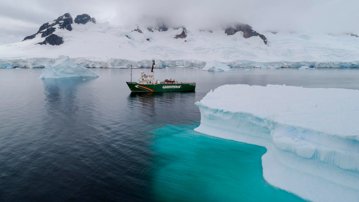 Greenpeace ship the Arctic Sunrise in Charlotte Bay, Antarctic Peninsula. Greenpeace is on a three-month expedition to the Antarctic to carry out scientific research, including seafloor submarine dives and sampling for plastic pollution, to highlight the urgent need for the creation of a 1.8 million square kilometre Antarctic Ocean Sanctuary to safeguard species like whales and penguins.