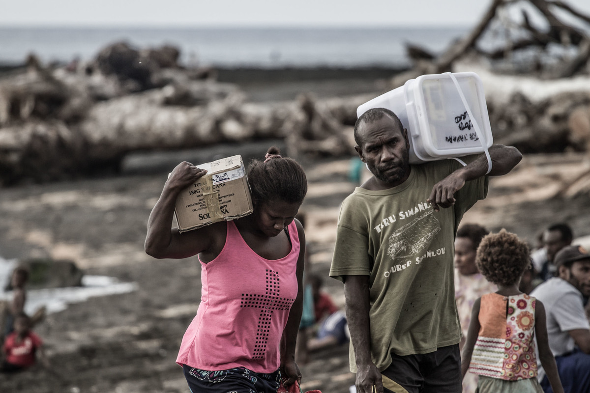 Locals from Port Narvin Village, Erromango receiving food supplies from Greenpeace. Extreme weather events, such as Cyclone Pam, threaten to become the new normal for Pacific island states as the global climate changes, underscoring the urgency to cut global emissions to avert a climate crisis.